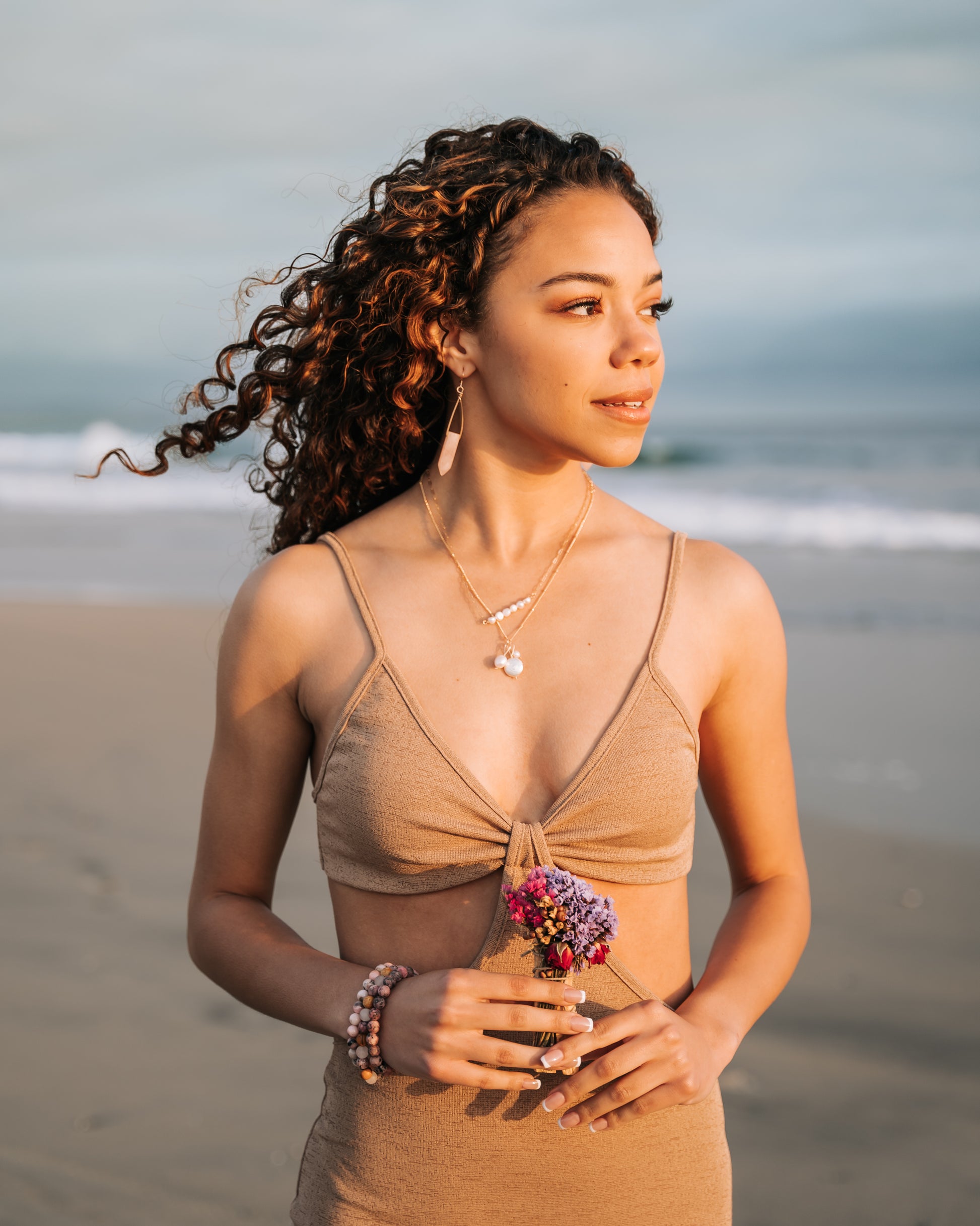 Close-up view of a trio pearl necklace featuring different-shaped and sized genuine pearls suspended on a delicate 14K gold fill chain. The pearls exhibit a lustrous finish, while the necklace showcases a waterproof and tarnish-proof design for worry-free wear. A timeless and elegant accessory that adds sophistication to any outfit."