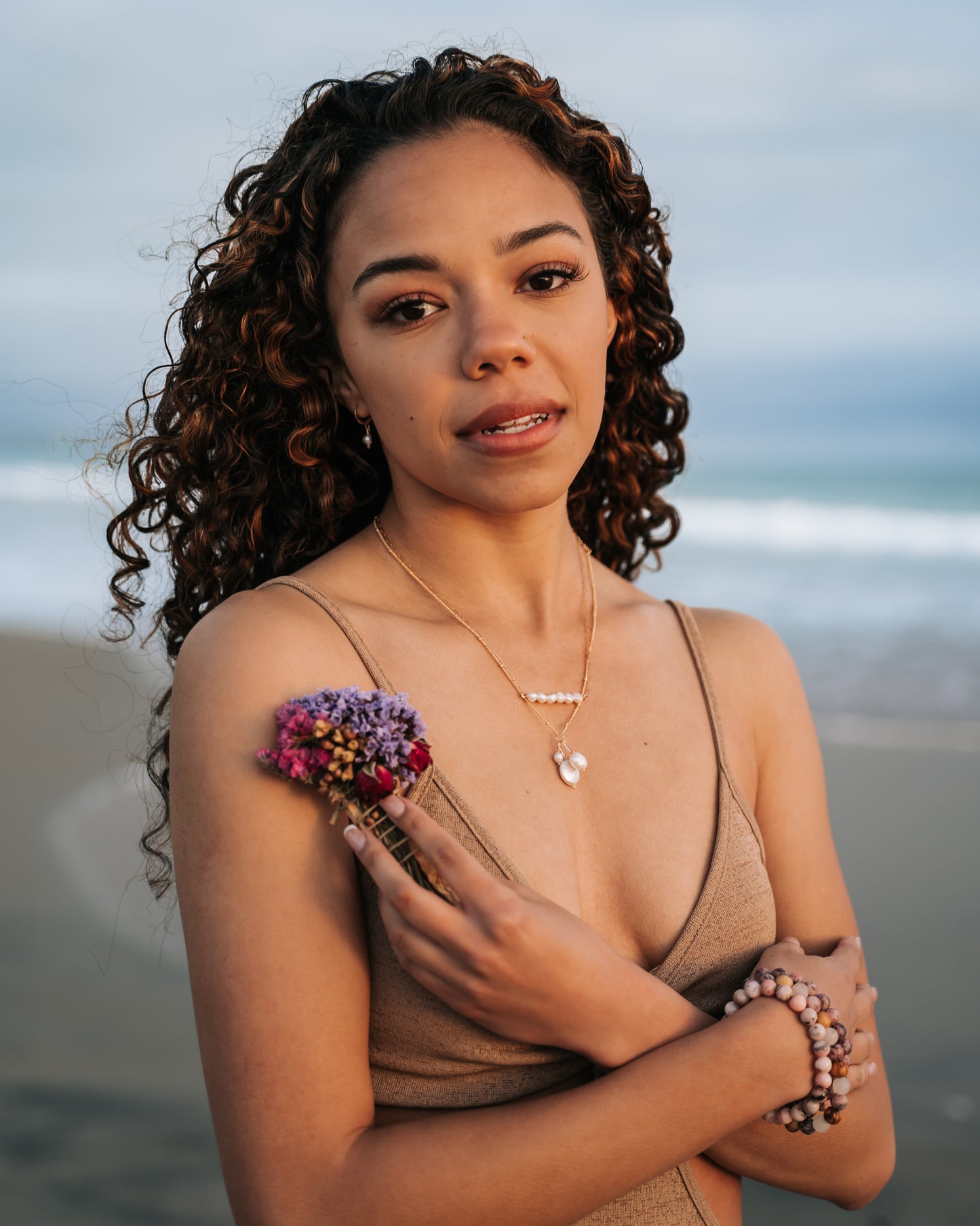 Close-up view of a trio pearl necklace featuring different-shaped and sized genuine pearls suspended on a delicate 14K gold fill chain. The pearls exhibit a lustrous finish, while the necklace showcases a waterproof and tarnish-proof design for worry-free wear. A timeless and elegant accessory that adds sophistication to any outfit."